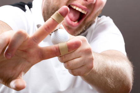 Slingshot making on mans fingers closeup pictureの写真素材