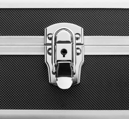 Closeup of lock on a metal briefcaseの写真素材