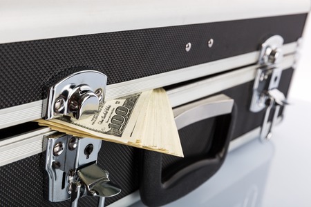 Case full of dollar on white 