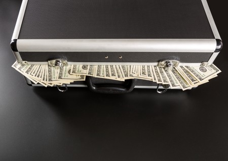 Case with dollars inside isolated の写真素材