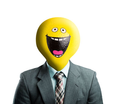 Businessman with balloon smiley face instead of his headの写真素材