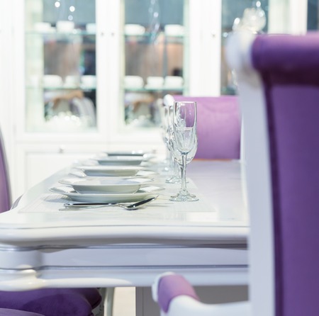 Served table with a kitchen tools in white and purple colorsの写真素材