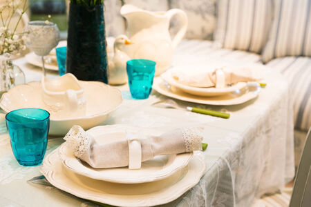 Served with a kitchen tools on the table with glases and plates