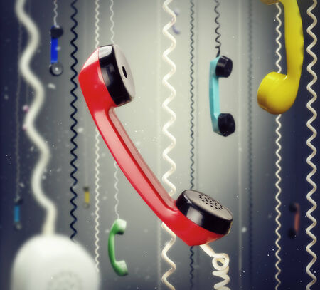 Lots of hanging telephone handsetsの写真素材