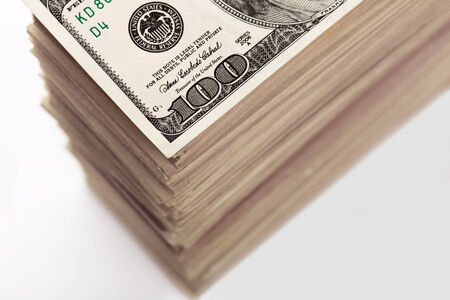 Crop of big stack of dollar banknotes closeupの写真素材