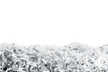 Big heap of white shredded papers isolated on whiteの写真素材