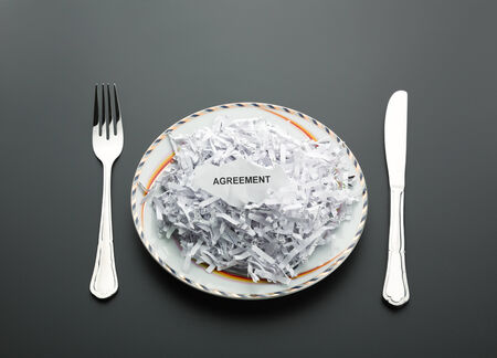 Table set with shredded agreement on the plateの写真素材