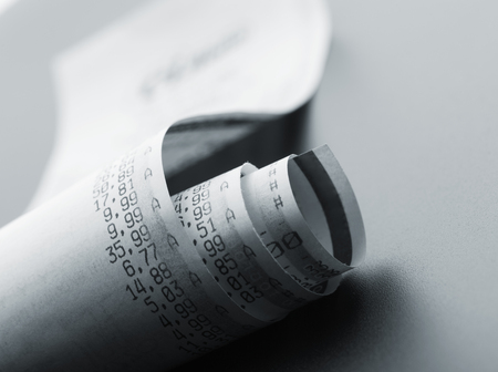 Grocery shopping list with prices on a till roll printoutの写真素材