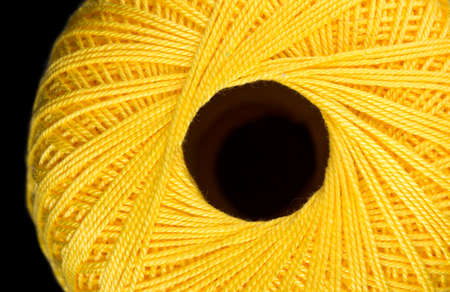 Yellow tangle of thread for knitting. Top view