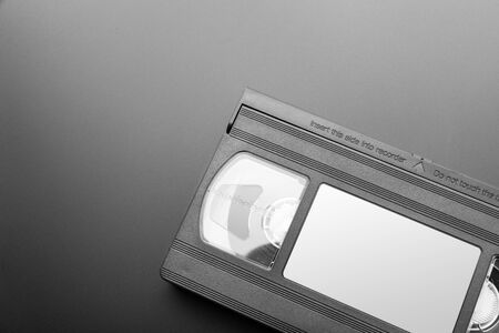 Old video cassette on the grey background