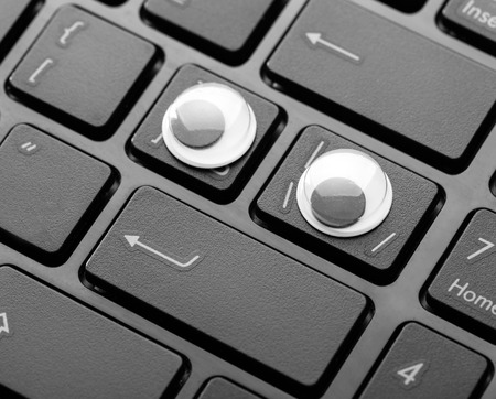 Closeup picture of keyboard with plastic eyes of a modern laptop