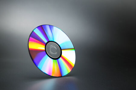 Compact disk on grey background