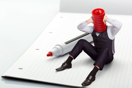 A man sitting near high-lighter thinksの写真素材