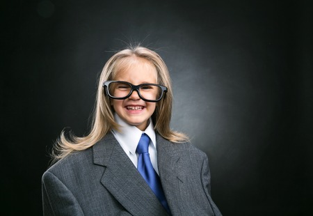 Funny little business girl with long hairの写真素材