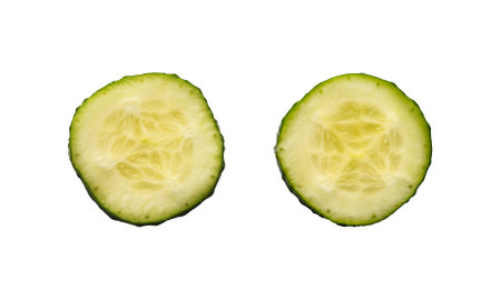 Two fresh slices of cucumber isolated on white backgroundの写真素材