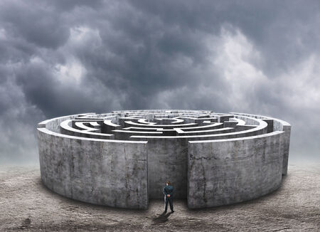 3D circular labyrinth against cloudy skyの写真素材