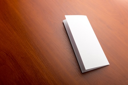 Closed letter lies on a wooden table