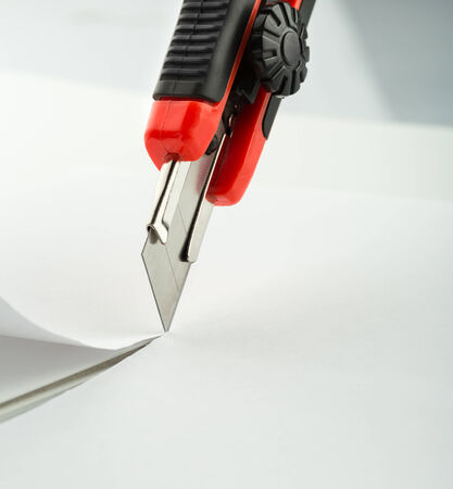 Red office knife isolated on white backgroundの写真素材