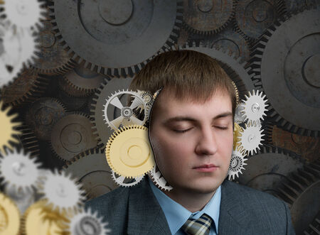 Man with mechanism in his headの写真素材