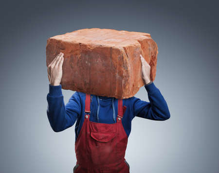 Man with a big brick insread of his head