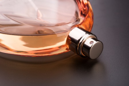 Closeup of perfume bottle on blackの写真素材