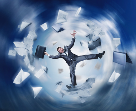 Businessman falling in space with papersの写真素材