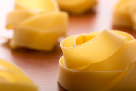 Closeup of homemade pasta on the tableの写真素材