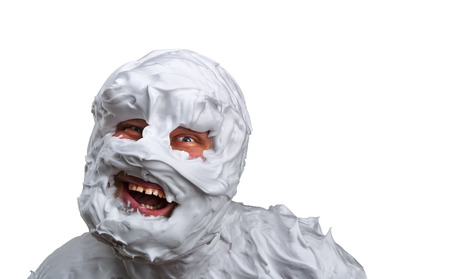 Spooky monster covered with foam isolated on whiteの写真素材