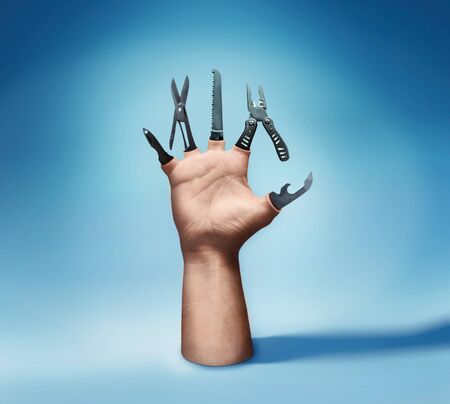 Human hand with various tool instead of fingers
