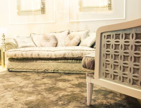 Luxury beige interior with nice white sofaの写真素材