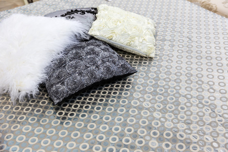 Modern luxury bed with pillows close up