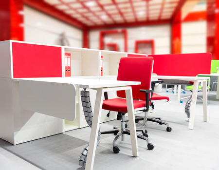 Office workers place with modern interior in red tonesの写真素材