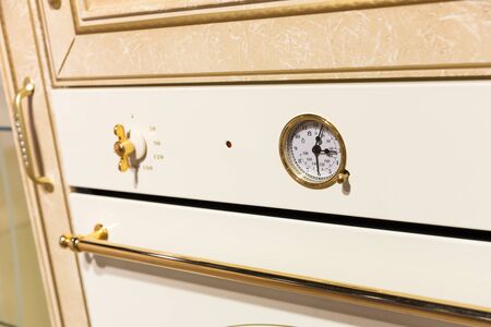 Closeup of an oven timer in the kitchen