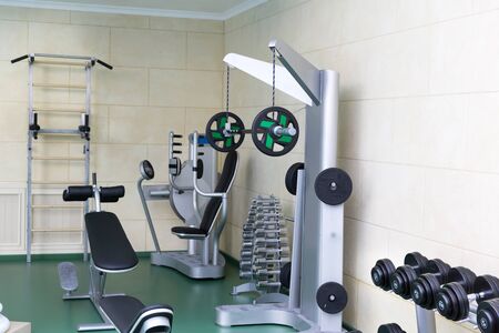 Fitness club gym with sport equipment modern interior