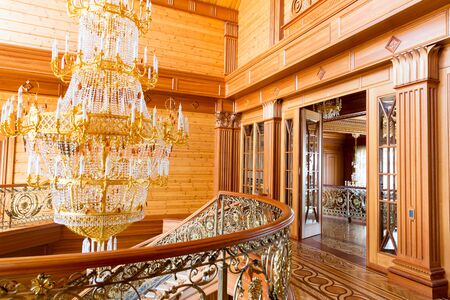 Novi Petrivtsi, Ukraine - May 27, 2015 Mezhigirya residence of ex-president of Ukraine Yanukovich. Modern gilded chandelier in the hallのeditorial素材