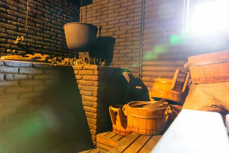 Cauldron for boiling water in the old bath-house roomの写真素材