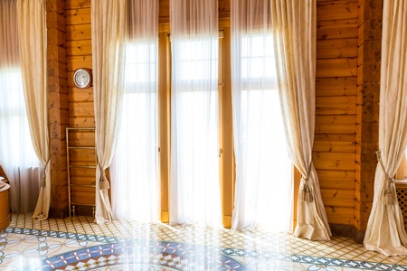 Novi Petrivtsi, Ukraine - May 27, 2015 Mezhigirya residence of ex-president of Ukraine Yanukovich. Close up of entrance door with modern curtainsのeditorial素材