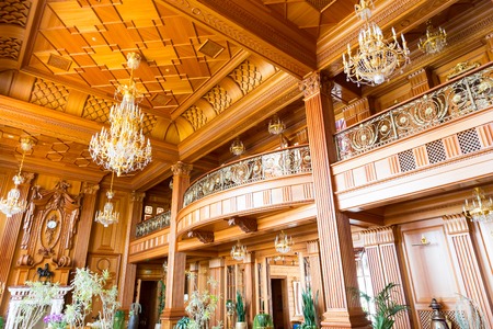Novi Petrivtsi, Ukraine - May 27, 2015 Mezhigirya residence of ex-president of Ukraine Yanukovich. Main hall of luxurious "Khonka" house. Ceiling viewのeditorial素材