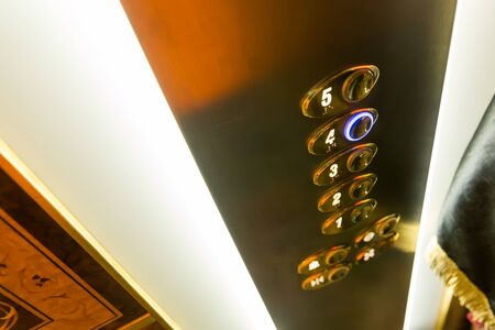 Up view of modern elevator buttons close up