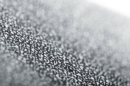 Black numbers and letters on white textureの写真素材