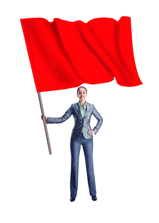 Woman holding a red flag stands isolated on white backgroundの写真素材