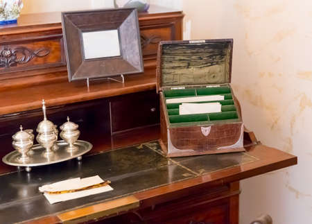 Little vintage box with letters on the tableの写真素材