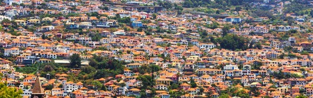 Little brick houses with orange roof on the hills, Portugal, Madeiraの写真素材