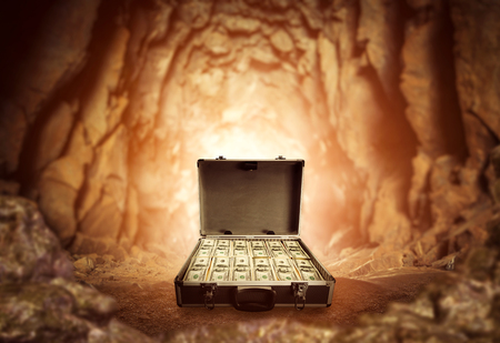 Case full of money stands in the caveの写真素材