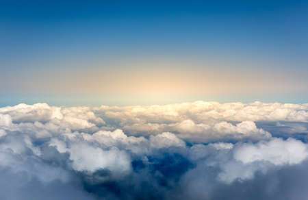 Aerial view of blue sky above the cloudsの写真素材