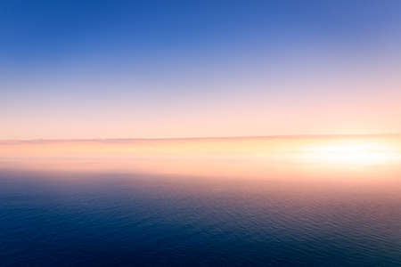 Panorama of clear sky above the clouds at sunsetの写真素材