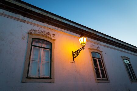 Lantern on the house turned on in the eveningの写真素材