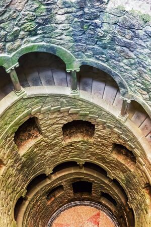 Up view of ancient tower with spiral staircase outdoorの写真素材