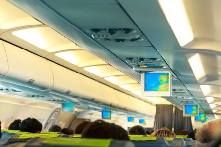 People sitting on the seats in the plane salon