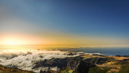 Aerial view of sea and mountain landscape in the cloudsの写真素材